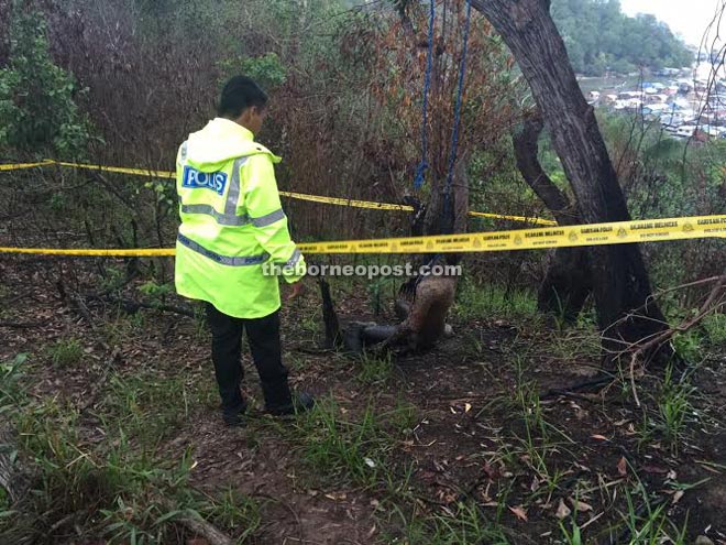 The decomposed body of the man found under a tree at Pulau Gaya on Wednesday.