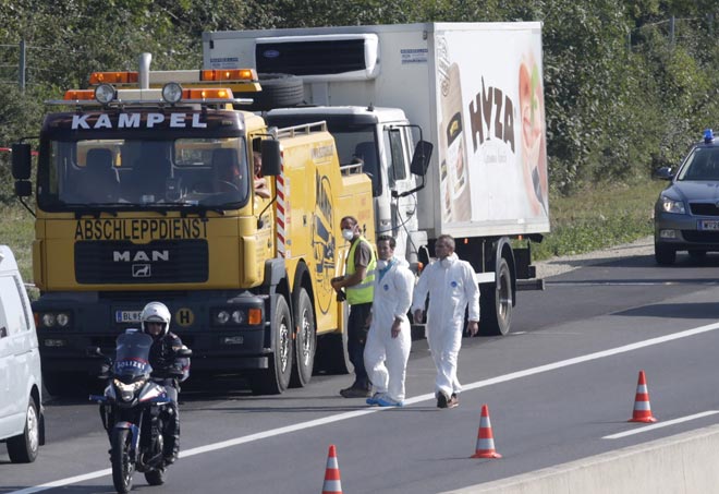 A truck in which up to 70 migrants were found dead, is prepared to be towed away on a motorway near Parndorf, Austria. — Reuters photo