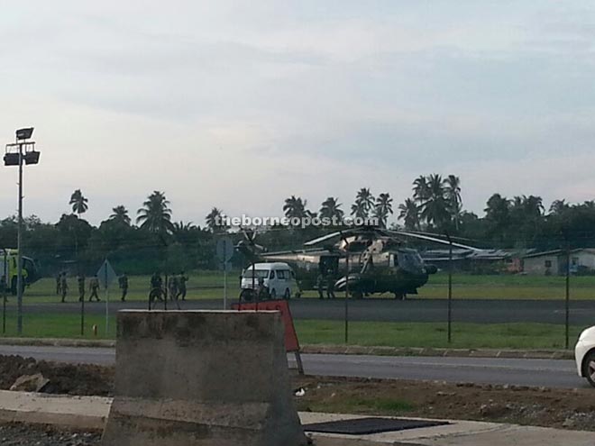 The body of Corporal Raju Karno Rano Karno being flown to his hometown in a Nuri helicopter at the Lahad Datu airport about 6.30pm yesterday.