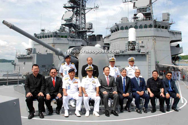 Nakasuji (seated fourth left) and his officers with Teo (seated fifth left) and other guests on board Ikazuchi (DD-107).