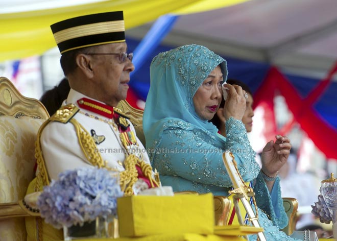 Tuanku Abdul Halim (left) and Tuanku Hajah Haminah are touched by the pantomime performance (pictured right) which told the story of an attack on the Kuala Krau police station in Pahang on June 26, 1948. In that attack, the heavily pregnant wife of policeman Mohd Yusoff Mohamad, Mahani Konel, was killed while helping her husband defend the station from a communist attack. — Bernama photo