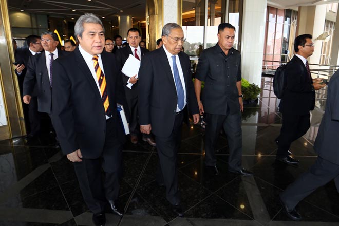 Adenan (second right) heading to his car after the adjournment of the DUN sitting yesterday. At left is Second Resource Planning and Environment Minister Datuk Amar Awang Tengah Ali Hasan. — Photo by Muhammad Rais Sanusi