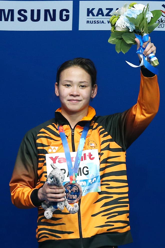 Pandelela celebrates during the podium ceremony of the Women’s 10m platform final diving event at the FINA World Championships in Kazan. — AFP photo