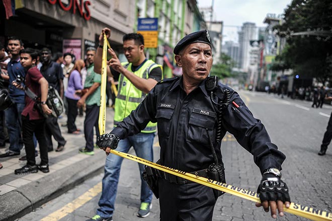 Royal Malaysian police cordoned an area during a protest against Najib in Kuala Lumpur. — AFP photo