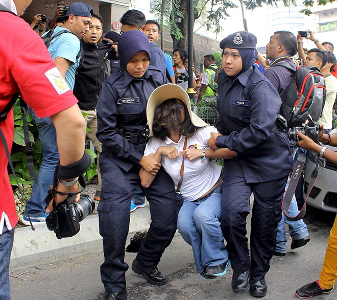 A woman among arrested during the rally. — Bernama photo