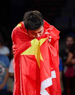 China’s Chen Long celebrates after winning the men’s single final at the 2014 BWF Badminton World championships held at the Ballerup Super Arena in Copenhagen. — AFP photo