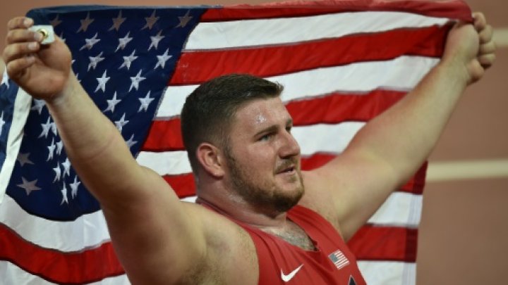 © AFP / by Alastair HIMMER | Joe Kovacs celebrates after winning the men's shot put world title in Beijing on August 23, 2015 