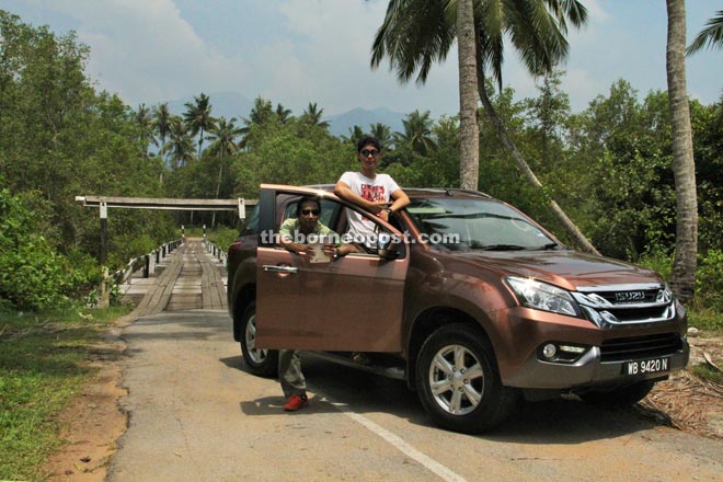 The newly launched ISUZU MU-X at the bridge which will lead to Tg Datu National Park, the spot where the proposed Pan-Borneo highway will start.