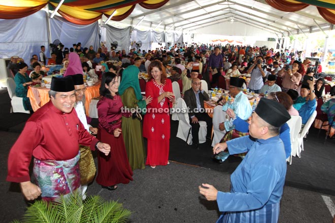Awang Tengah joins in a traditional Malay dance together with other guests. 