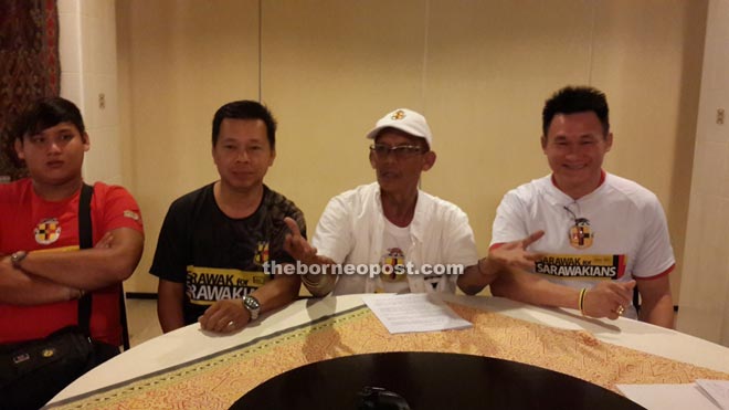 Peter John (second right) and his friends seen during the press conference.