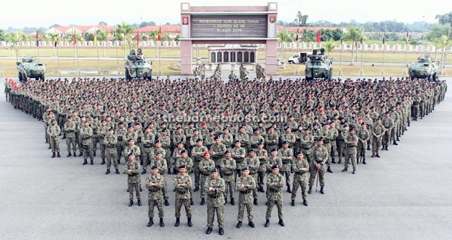 Stephen (front, centre) and his men gather for a group photo.