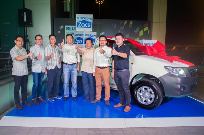 Photo shows the team at KianChion Co Sdn Bhd, the grand lucky draw winner, driving home a brand new Toyota Hilux.