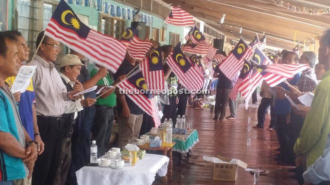 Community leaders among the 300 Penans at the fly the Jalur Gemilang ceremony.