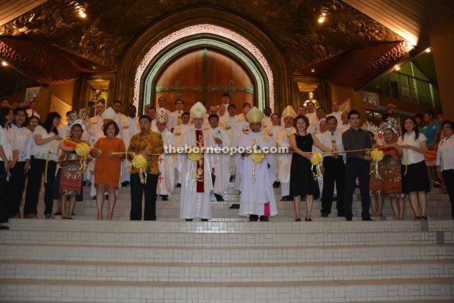 (From fourth left) Archbishop Marino, Bishop Hii and others before the Re-dedication Mass at Sacred Heart Cathedral here.