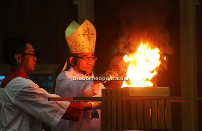 Bishop Hii incenses the altar.