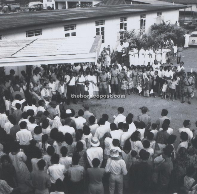 The welcoming party at the Kuching airport listening attentively to the speeches being made by the leaders of the Sarawak Alliance Party.