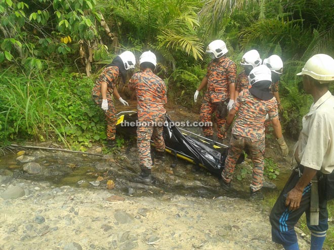 Fire and Rescue Department personnel retrieving the body from the river.