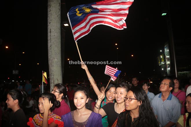 Some youths waving the Malaysian and state flags at the closing.