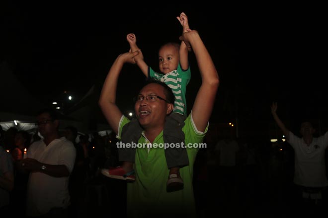 A father and son join in the celebration. 