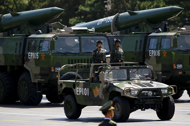 Military vehicles carry short-range ballistic missiles during the military parade to mark the 70th Anniversary of the end of World War Two, in Beijing, China. — Reuters photo