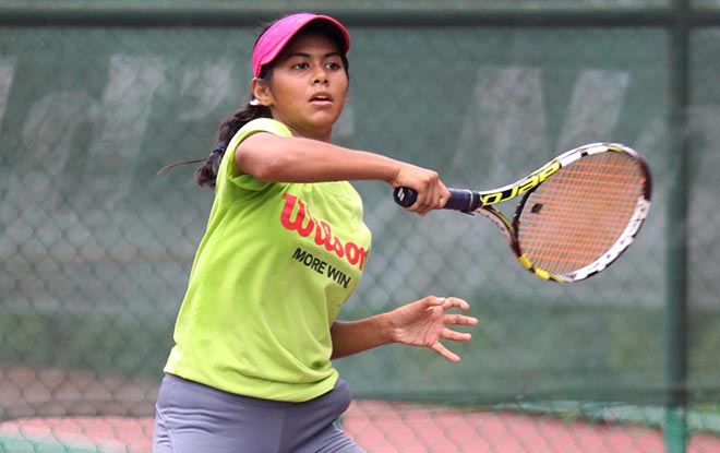 Nil Farah Fahrol Rodzi moves into the last eight of the girls’ singles of the 11th Sarawak ATF U14 Series tennis championships after defeating Hong Kong’s Elie Auyantung 4-6, 7-6 (3) 6-4. — Photo by Chai Chang Yu