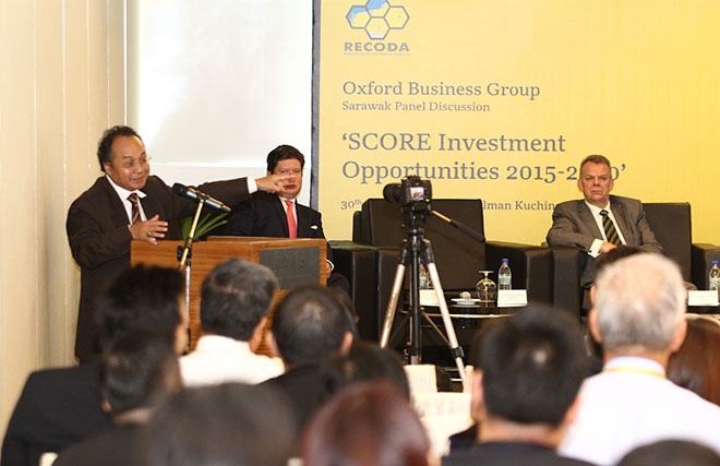 Baya (left) delivering his keynote speech at Oxford Business Group - Sarawak Panel Discussion with the title “SCORE Investment Opportunities 2015-2020” yesterday. — Photo by Chimon Upon
