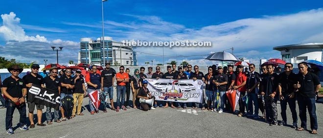 Some of the members taking photos at their gathering point at Labuan Halal Hub.