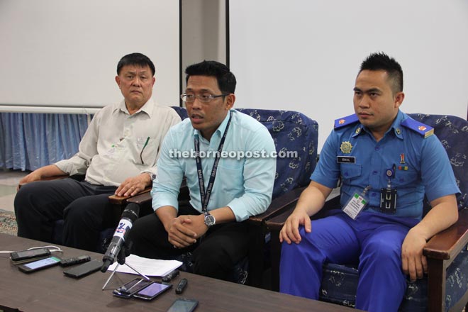 Shalihin (centre) fields questions from reporters. He is flanked by Loh (left) and Ismail.