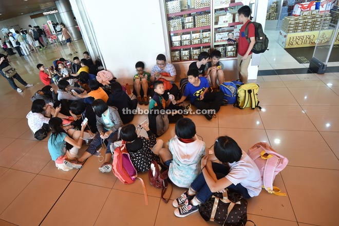 Passengers loiter at KIA while waiting for their flights. — Photo by Tan Song Wei