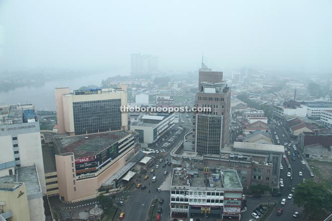 Visibility was poor at the Kuching golden triangle area as the city recorded an air pollutant index (API) exceeding 100 yesterday. — Photo by Chimon Upon