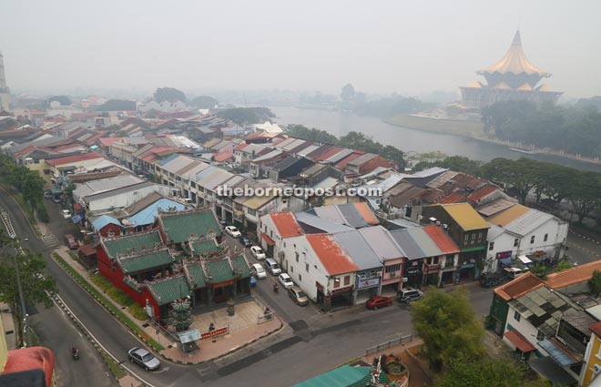 Hazy view of the State Legislative Assembly Building and Main Bazaar area from Medan Pelita. 