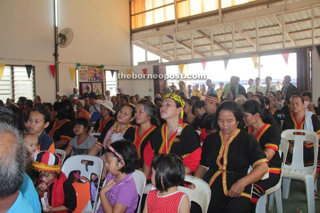 Local womenin traditional Bidayuh costumes are among those attending the function.