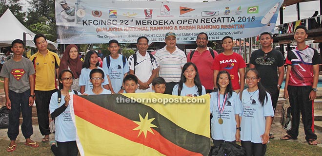 The state sailing team with Sarawak Yachting Association president Harifen (fifth right) at the end of the 22nd KFC/NSC Open Regatta at Tanjung Aru beach, Kota Kinabalu, in Sabah.