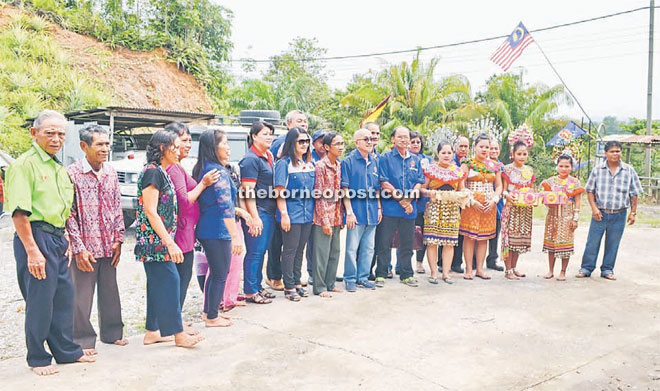 Residents of Manai longhouse having a group photo with Mohd Syafiq (front row, seventh right).