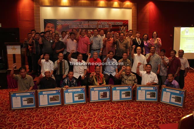 Awang Tengah (seated, fourth from left), flanked on his right by Arni and Dr Abdul Rahman, with representatives from the Lun Bawang, Malay and Tagal communities after presenting communal land reserves titles.