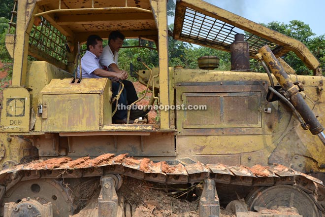 Alexander (left) performs the ground-breaking for the new Rumah Joshua.