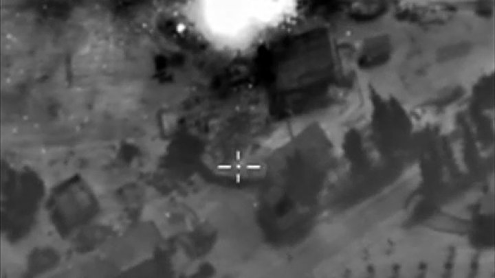 © Russian Defence Ministry/AFP / by Mona Salem | A video grab made on October 1, 2015, shows an image taken footage made available on the Russian Defence Ministry's official website, purporting to show an airstrike in Syria
