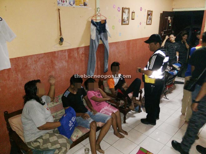 State Immigration Department personnel checking residents of a rented house.