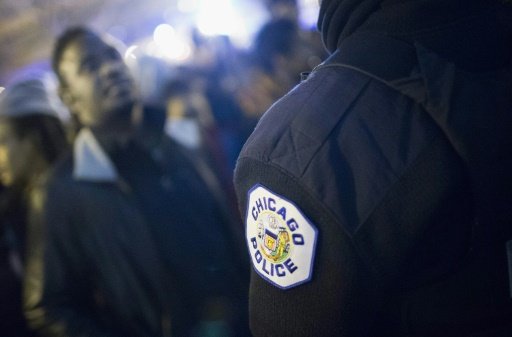 © Getty/AFP/File / by Mira Oberman | Demonstrators confront police during a protest following the release of a video showing Chicago police officer Jason Van Dyke shooting and killing Laquan McDonald, on November 24, 2015 in Chicago, Illinois