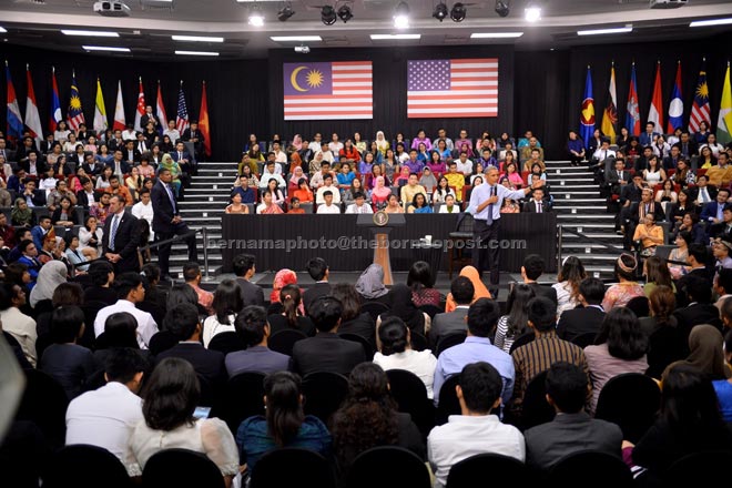 Obama expressing his views at the town hall meeting with alumni of the Young Southeast Asian Leaders Initiative at Taylor’s Lakeside University campus. — Bernama photo