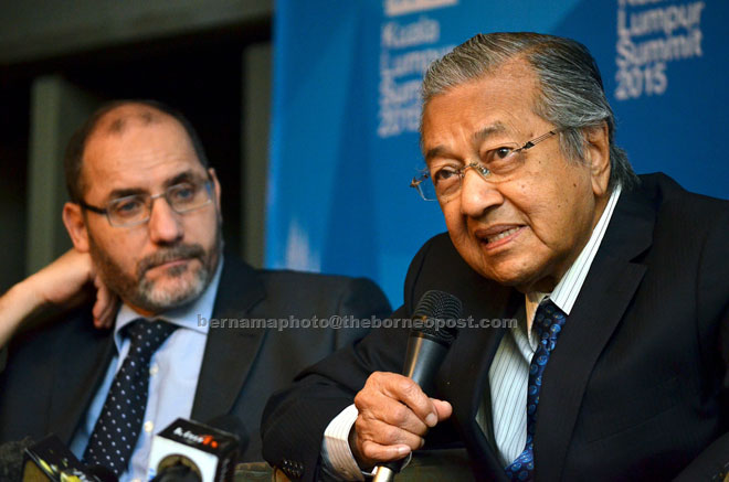 Dr Mahathir (right) speaks to the media after the launching of the summit. Looking on is conference secretary-general  Dr Abdul Razzaq Maqri.— Bernama photo