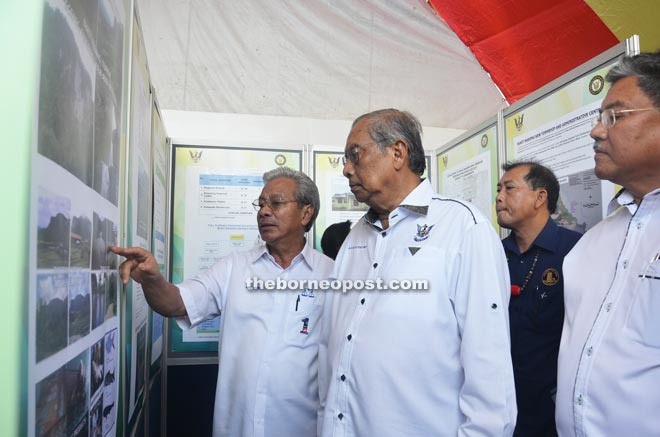 Masing (left) briefs Adenan (second left) on the Bukit Mabong District as Morshidi (right) and Ugak look on.