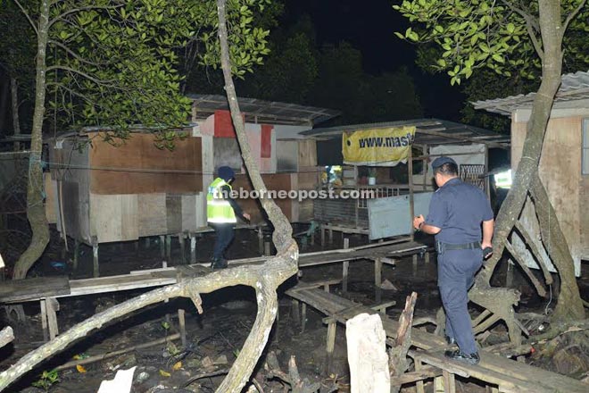 Police and enforcement teams inspecting squatters’ houses during the operation yesterday.