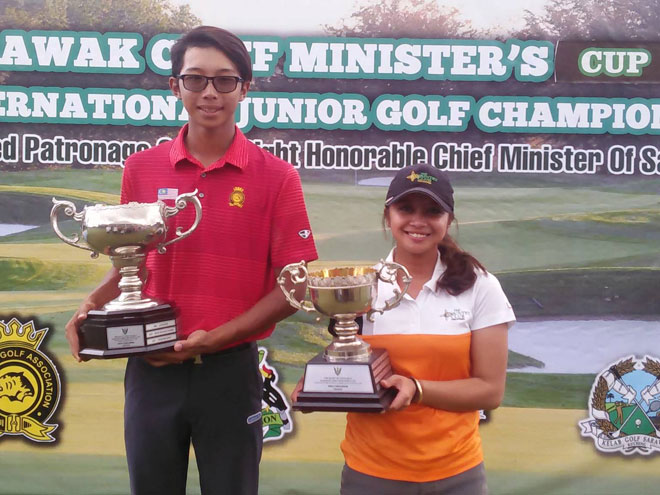 Suzairi Iqmah and Princess Superal posing with their top trophies after the prize presentation yesterday.