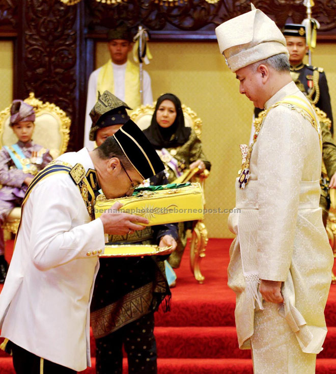 Defence Minister Datuk Seri Hishammuddin Tun Hussein receiving the posthumous award on behalf of his grandfather, the late Datuk Sir Onn Jaafar, from Sultan Nazrin Shah. — Bernama photo