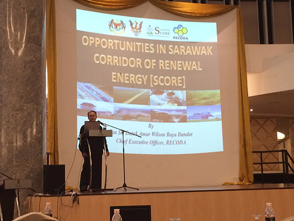 Image shows Siam during the seminar talking on the opportunities that are available for local Sarawakian companies.