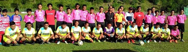 Players and officials of both teams gather for a photo-call before the friendly match. 