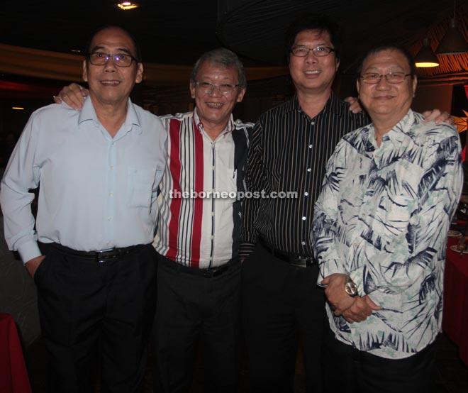 Bong (second left) has his picture taken with old friends. From left are Francis Wong Sek San, Dennis Ling Li Kuang and Goh Han Siang.