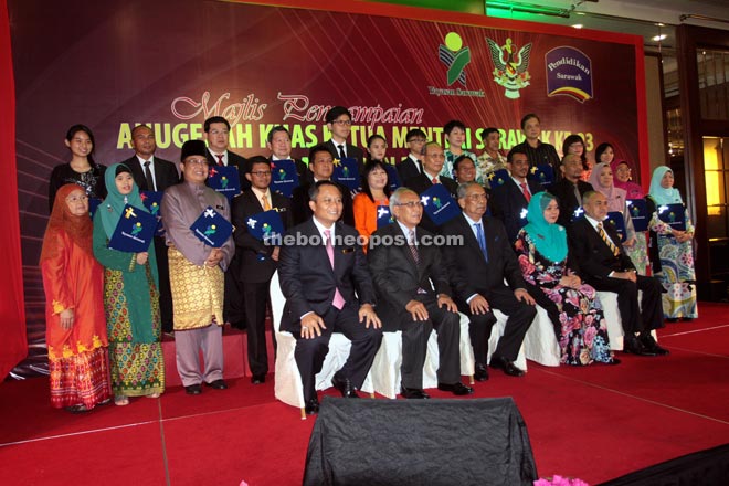 Adenan (seated, centre) joins a group photo with the recipients of the 23rd Chief Minister’s Awards. Seated with the chief minister are (from left) Abu Bakar, Deputy Chief Minister Datuk Patinggi Tan Sri Alfred Jabu, Rakayah and State Legislative Assembly Speaker Datuk Amar Mohamad Asfia Awang Nassar. — Photo by Jeffery Mostapa