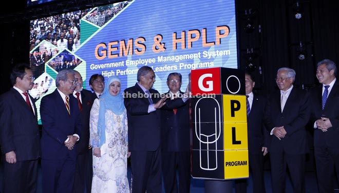 Adenan prepares to launch the Gems and SCS-HPL initiatives. On his right is his wife Datin Patinggi Dato Jamilah Anu. 